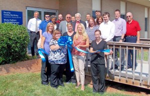 Shown at the Henderson-Vance Chamber of Commerce ribbon cutting for Daurity Family Dentistry are, Dr. Genny Daurity, and her staff (Sonia Hernandez, Brooke Grissom, Brooke Chadwick, Angela Nieves); Jeff Daurity; Ken Upright; Dr. Deuce Roberson, Roberson Family Dentistry; Allison Roberson; Dr. John R. van Venrooy, Specialist In Orthodontics; Amanda Whaley, Zach Rubin; Melvin Franklin; HVCC President John Barnes; HVCC Work First Coordinator, Vanessa Jones; Chamber Ambassador Cheryl Elman, Dave Elman Hypnosis Institute; Chamber Ambassador Kevin Bullock, WIZS 1540-AM; Chamber Ambassador Michael Bobbitt; Stuart Litvin, Director Vance County Economic Development; Not Pictured: HVCC Director of Membership Services, Annette Roberson.