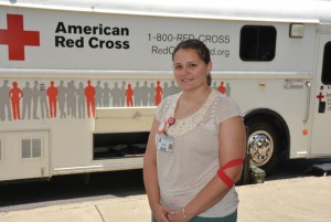 VGCC Nursing student Elaine Harrison is seen here in front of the “Bloodmobile,” which was parked in front of the Civic Center on VGCC’s Main Campus during the blood drive that she coordinated. (VGCC photo) 