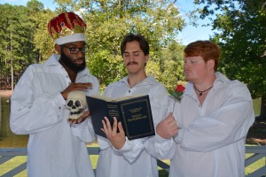 From left, VGCC students Jordan Bunting, Lee Powell and Spencer Nunn get into character outside on the college campus, while checking out the source material for “The Compleat Wrks of Wllm Shkspr (Abridged).” (VGCC photo) 