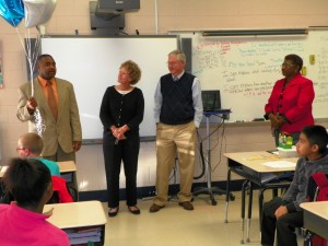 Cooper, far right, talks about his award while board members, from left, Ruth Hartness, Ed Wilson and Dorothy Gooche, look on.