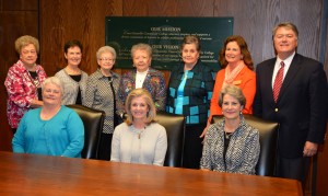 Representatives of Dr. Mills’s family, the Guild and VGCC gathered in the board room on the college’s Main Campus to mark the creation of the new scholarship. Seated, from left, are Kathy Mills Williams, Janet Mills and Jane Mills Hicks, all of Henderson. Standing, from left, are Guild Gift Gallery volunteers Gean Bobbitt, Roxanne Fleming, Lou Reavis, Sylvia Edwards and Guild president Anne Bunch, all of Henderson, VGCC Endowment Specialist Kay Currin and Endowment Director Eddie Ferguson. (VGCC photo)