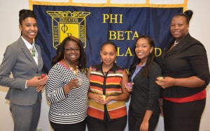 Phi Beta Lambda chapter officers for 2015-16 include, from left, president Angelica Bridges of Oxford, vice president Ambrianna Winston of Oxford, secretary Ashley Allen of Henderson, historian Shekinah Yancey of Oxford and treasurer Tiffany Barnes of Henderson. Each holds a candle symbolizing her leadership role. (VGCC photo)