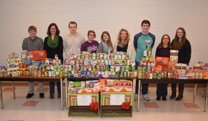 The VGCC History Club poses with items donated during their recent food drive, before delivering them to the Food Bank of Central and Eastern North Carolina. Pictured, from left: students Thomas Grissom of Henderson, Jessie Hartley of Oxford, Lucas Thompson of Wake Forest, Jennifer Burns of Henderson (club president), Ashley McEntee of Oxford, instructor/club advisor Victoria Klesmith, John Slaton of Henderson, instructor/club advisor Natasha Thompson, and Katelynn Ray of Henderson. (VGCC photo)