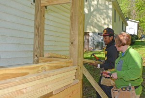 VGCC Carpentry students Mycal Elam of Warrenton and Robyn Horner of Durham work on the back of a house in Henderson that is being completed in partnership with Granville County Habitat for Humanity. (VGCC photo)