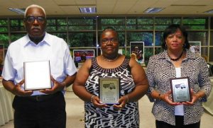The award winning drivers are shown in the photo and include, left to right, Fermon Bostic, first place; Mary Person, second place; and Jeanette Cousin, third place. They each hold a plaque presented to them for their achievements.