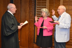 Resident Superior Court Judge Henry W. “Chip” Hight, Jr., left, administers the oath of office to Trustees Sara C. Wester, center, and Donald C. Seifert, Sr., for new four-year terms on the board. Wester is appointed by the Vance County Board of Commissioners and Seifert by the Vance County Board of Education. (VGCC photo)