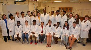 Students shown here at VGCC’s Franklin Campus are seated, from left: Victoria Michel (Wake Forest High), Iris Medrano of Creedmoor (home-schooled), Malik Pettis (Wake Forest High), Sascha Anderson (Vernon Malone College and Career Academy), Rachel Hortman (a recent graduate of Fuquay-Varina High), Yvon’ne Lyle (Garner High), Amanda McPhatter of Wake Forest (home-schooled) and Caroline Pruitt (Sanderson High); standing, from left: instructor Becky Brady with students Autumn Boone (Middle Creek High), Sabrina Bedard  of Wake Forest (home-schooled), Karson Turner (Enloe High), Edin Medrano of Creedmoor (home-schooled), Sarah Bryant (Wake Forest High), Nadia Hodges of Wake Forest (home-schooled), Brandon Yarborough (Wake Young Men’s Leadership Academy), Kendall Smith (Wake Young Men’s Leadership Academy), Saikiran Devanga Chinta (Green Hope High), Bryson Vick (Warren County High), Lizzie Leegins (North Johnston High), Jillian Radford (North Johnston High) and Jacob Harris (Henderson Collegiate). Not pictured: Parker Stantz (Wakefield High). (VGCC photo)