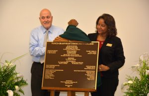 VGCC Dean of Continuing Education Dale Fey (left) and Dean of Business & Applied Technologies Angela Gardner-Ragland (right) unveil the dedication plaque for Building 10 during the Aug. 3 ceremony. (VGCC photo)